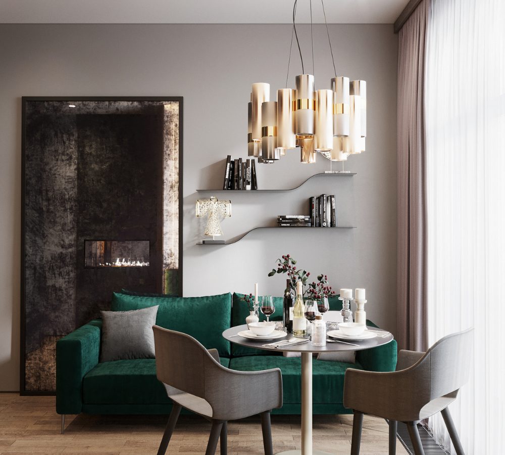 Zona pranzo della suite con divano verde e lampadario