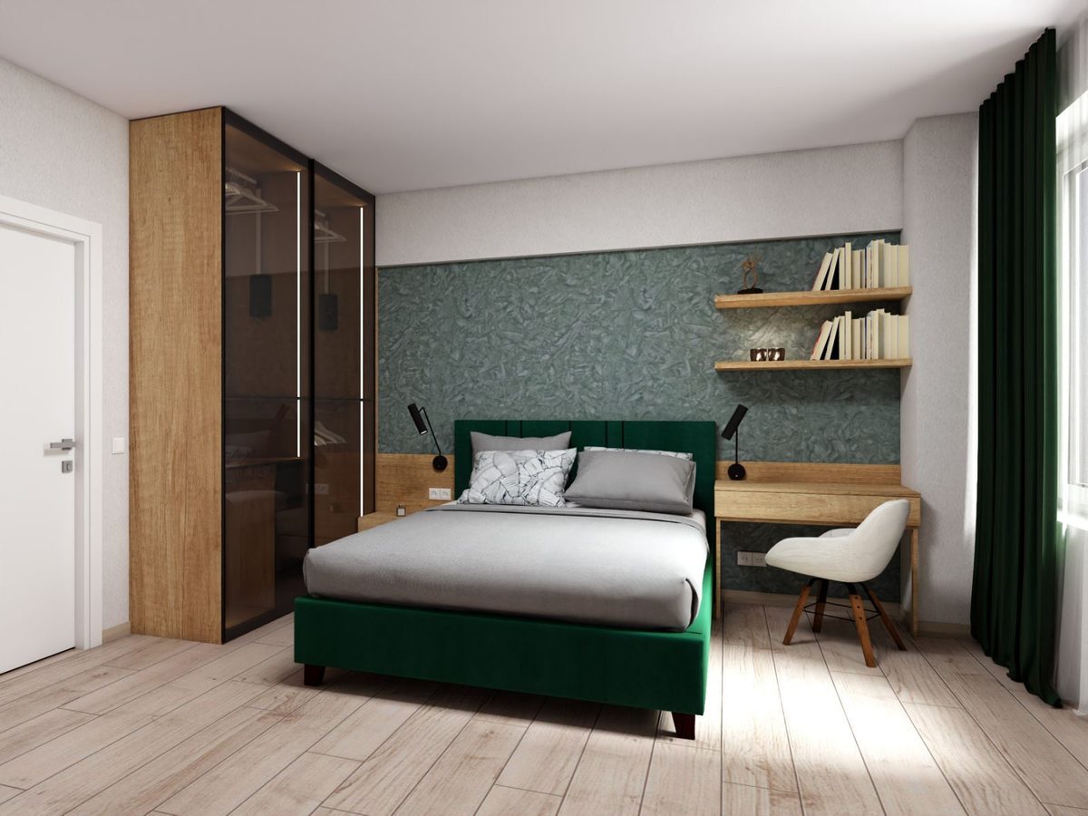 Schlafzimmer mit grünem Bett, Schrank und Arbeitsplatz
