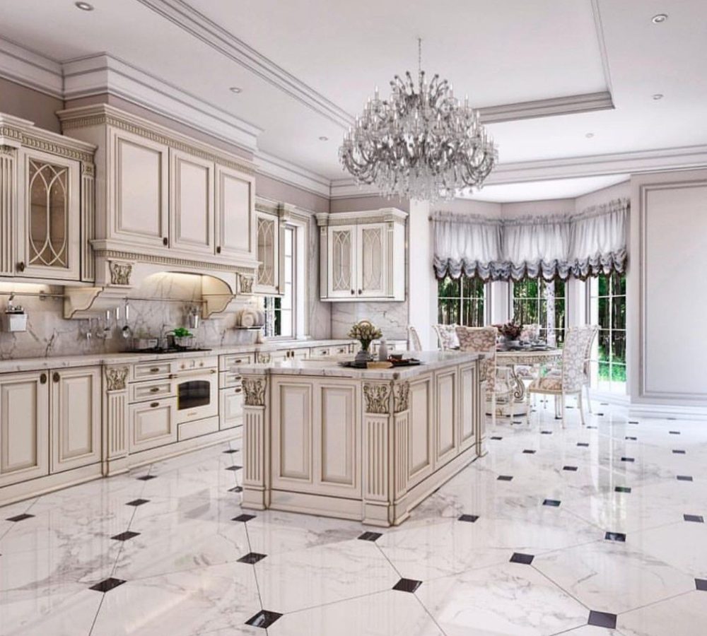 Spacious classic kitchen with an island and crystal chandelier