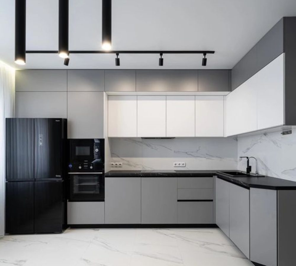 Grey and white corner kitchen with track lighting