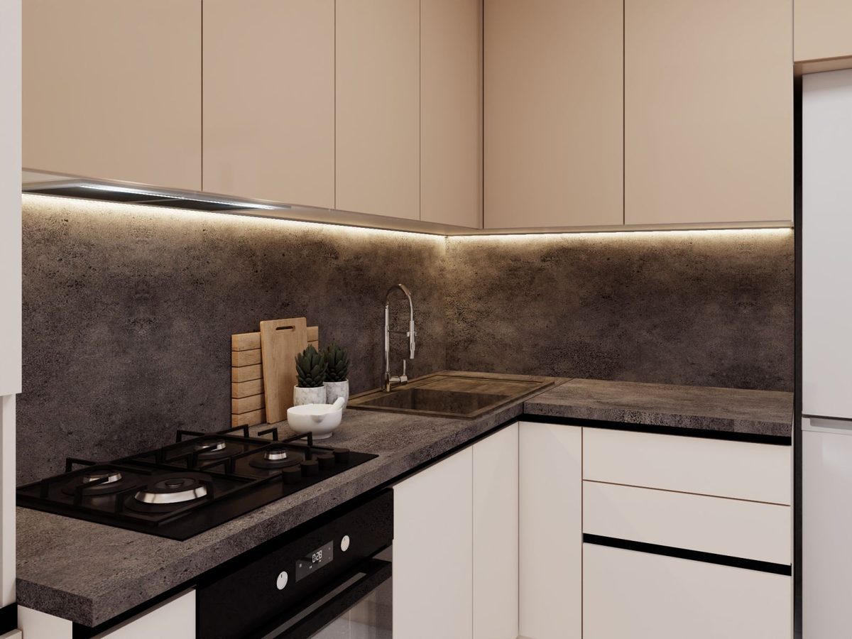 Hob and sink against a dark stone splashback