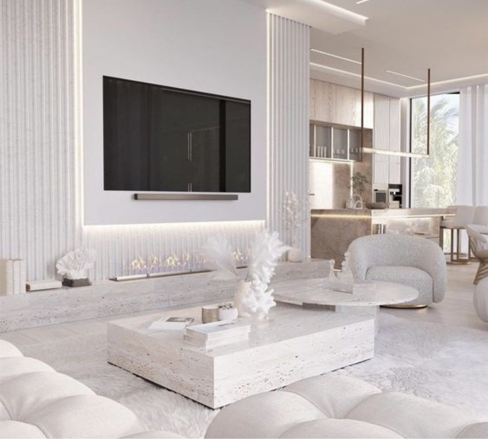 Soggiorno bianco con zona TV e tavolino in marmo