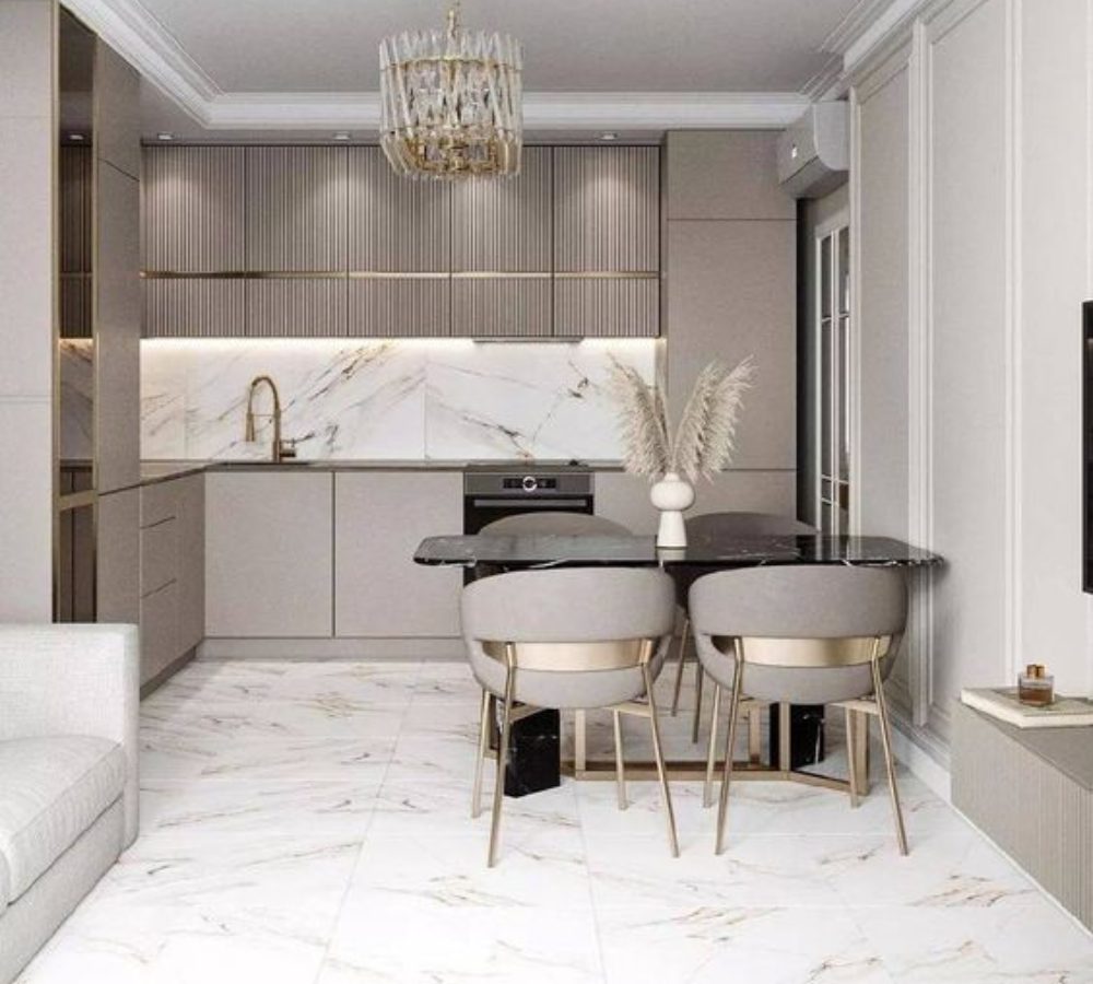 Light kitchen with a marble splashback and dining table