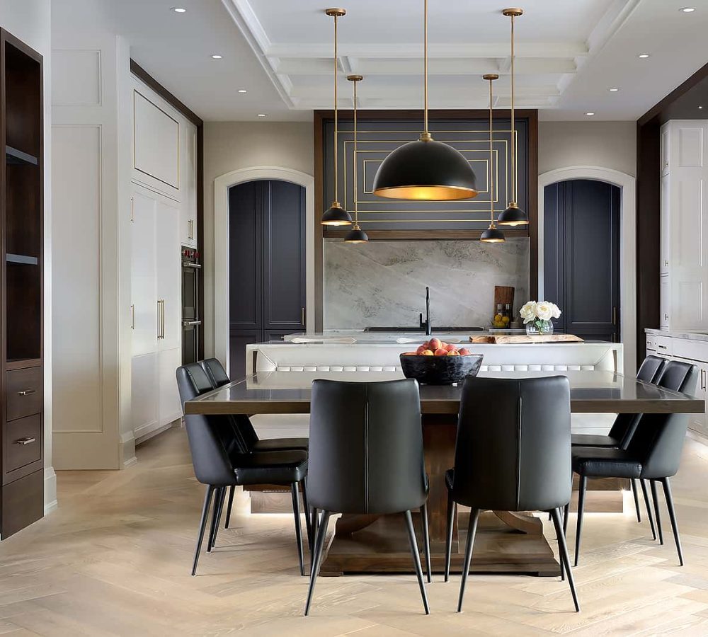 Kitchen-diner with a dining table and black pendants