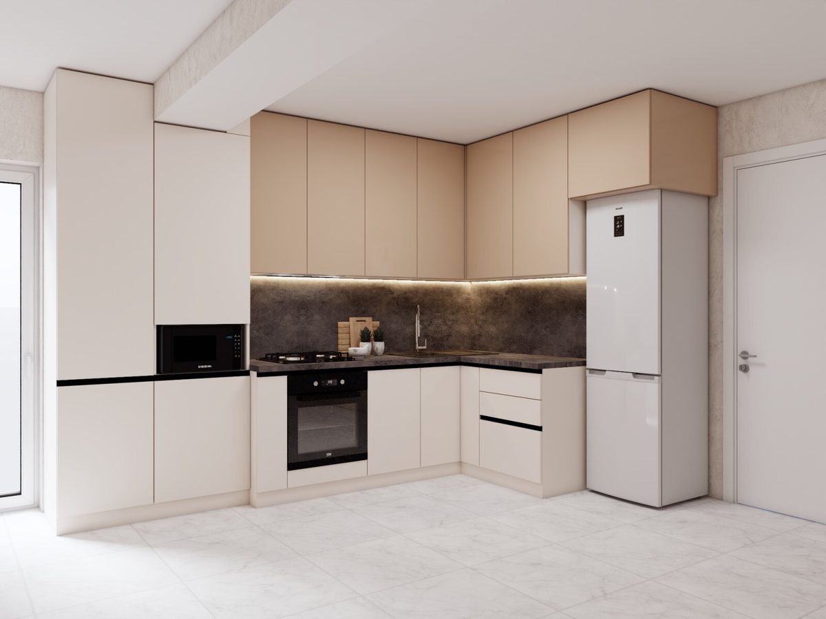 Beige and white kitchen with a fridge in a niche