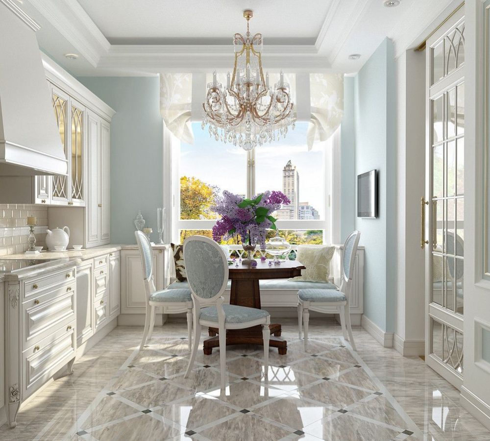 Mint-toned kitchen with a dining table by the window