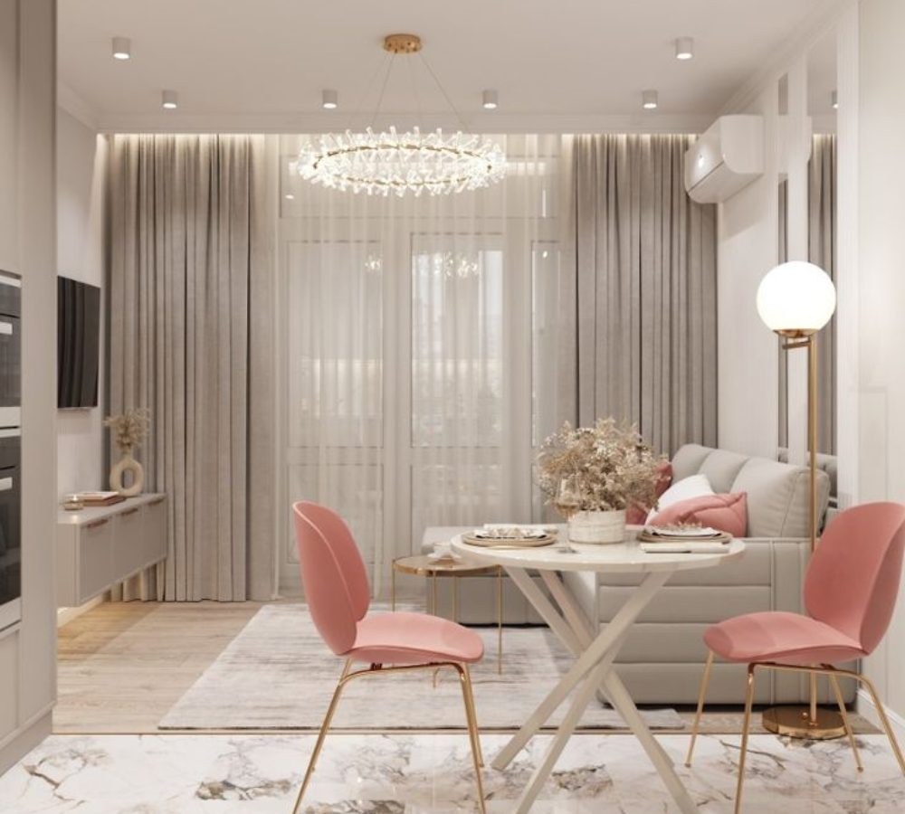Open-plan kitchen with a dining table and pink chairs